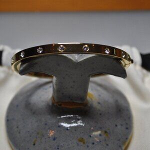 Kate Spade gold hinged bangle bracelet with crystals